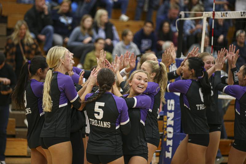 Downers Grove North celebrates their win over Downers Grove South in the Class 4A Lyons Sectional Semifinal volleyball match. Nov 4, 2025 in La Grange.
