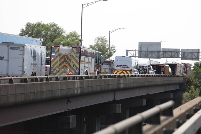 Dozens of emergency vehicles line eastbound I-80, near the Richards exit, to clean up hazardous materials following a semi-trailer leak on Friday, June 16, 2023 in Joliet.