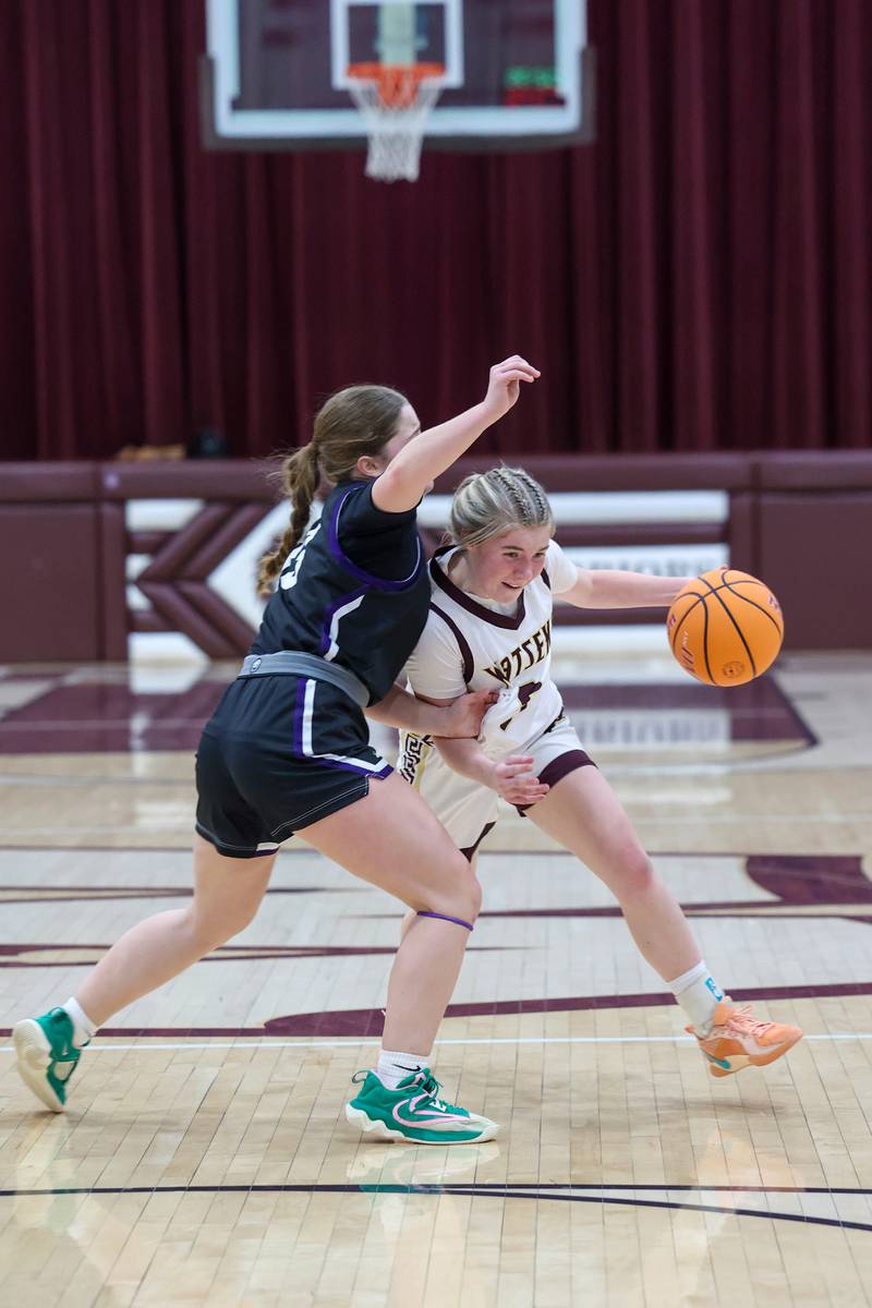 Watseka/Milford's Rennah Barrett drives against Manteno's Brooke Blanchette during Manteno's 57-52 victory on Wednesday, Jan. 21, 2026.