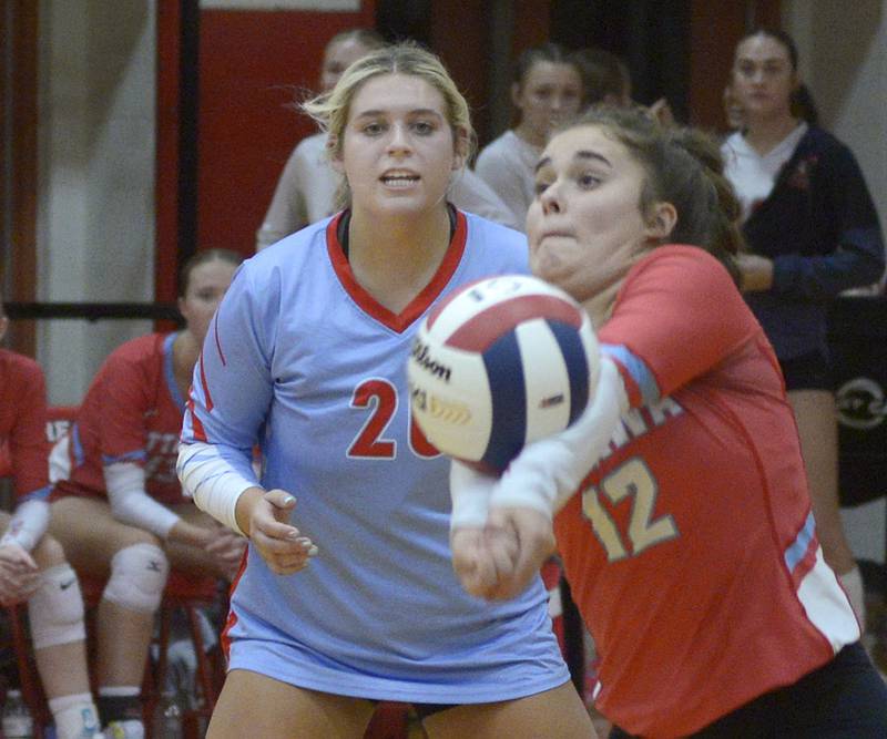 Ottawa’s Reese Burgwald looks on as team mate Haley Waddell returns a serve  during the second match Tuesday at Streator.