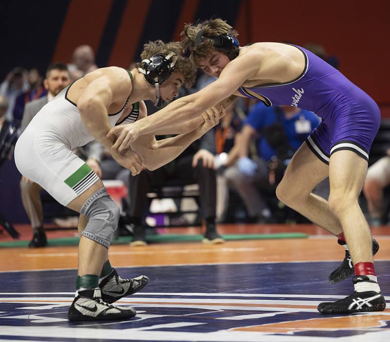 Providence Catholic’s Justus Heeg works against Brock Ross of Mascouta in the 2A 157 pound title Saturday, Feb. 21, 2026, at the IHSA wrestling finals in Champaign.