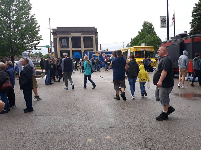 After the rain stopped at about 2 p.m. Saturday, May 21, 2022, the crowds grew at the Streator Food Truck Festival in City Park.