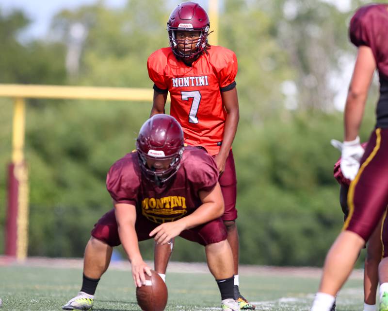 Izzy Abrams looks over the defense before the snap during a live scrimmage at Montini High School football practice. Aug 22 2024.