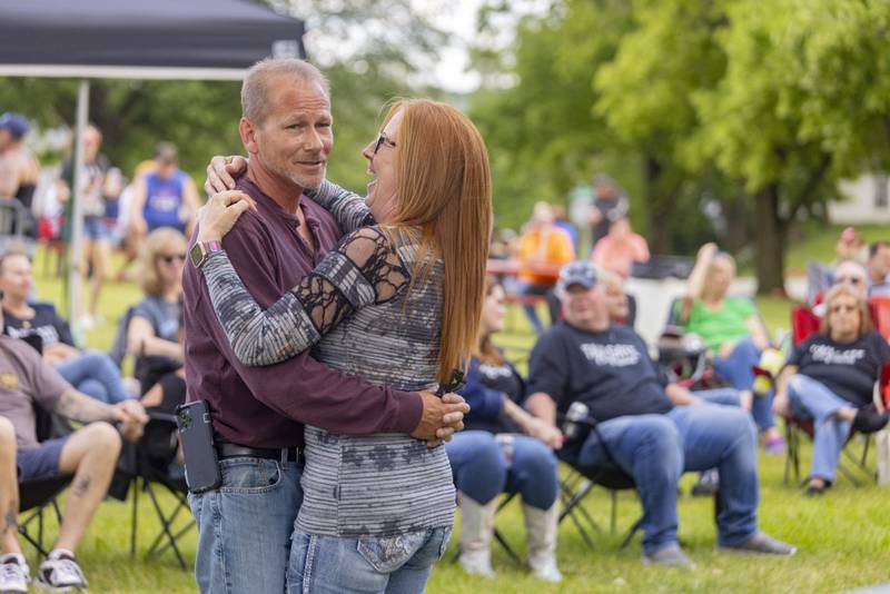 Bryon and Ellen Anderson slow dance Sunday, May 26, 2024, to the song "Tennessee Whiskey," while Abbynormal performs at the Music and Arts Festival at Pulaski Park in La Salle.
