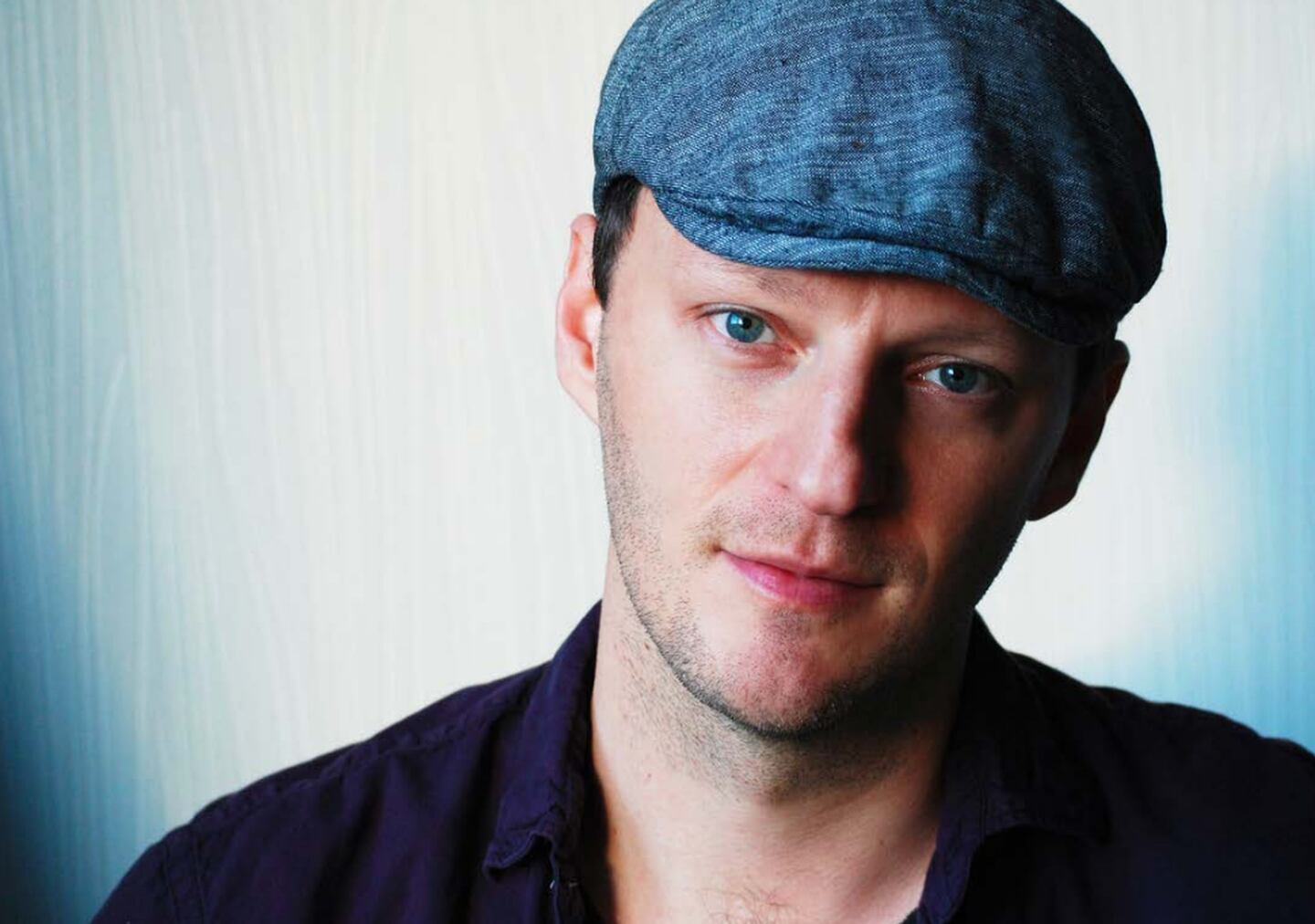 Cory Krueckeberg, Genoa native Tom Gustafson’s partner, wrote the script for “Glitter & Doom” and gave it to Gustafson for their 20th anniversary. The film is loosely inspired by the couple meeting for the first time in Chicago in 1998.