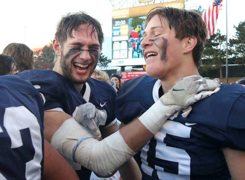 Cary-Grove's Kyle Jarecki (left) and Jake Hornok celebrate Saturday, Nov. 25, 2023, after their win over East St. Louis in the IHSA Class 6A state championship game in Hancock Stadium at Illinois State University in Normal.