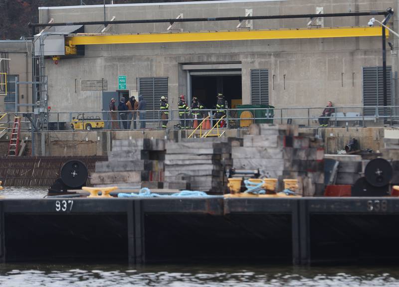 Utica firefighters gather at the entrance to the Peru Hydroelectric Power Plant on Tuesday, Jan. 13, 2026 at the Starved Rock Lock and Dam near Utica. A light haze of smoke was coming from inside the power plant. Fire departments from Tonica, La Salle, Wallace, Tonica, Peru and Utica all responded to the scene. The incident happened shortly before 2:30p.m. No injuries were reported.