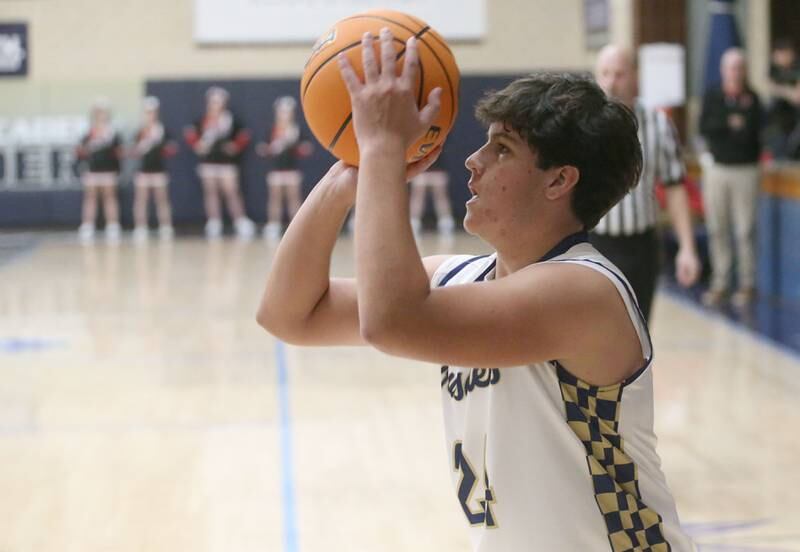 Marquette's Matt Graham shoots a wide-open jump shot against Earlville on Friday, Jan. 3, 2025 in Bader Gym at Marquette High School.