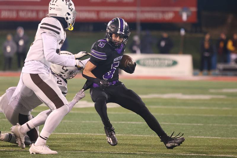 Downers Grove North’s Owen Thulin makes a cut after a catch against Mt. Carmel in the Class 7A championship on Saturday, Nov. 25, 2023 at Hancock Stadium in Normal.