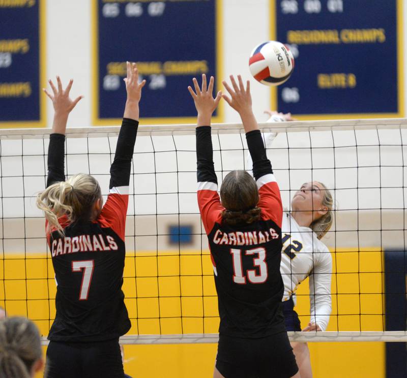 Polo's Katelyn Rockwood (12) hits the ball past Forreston's Hannah Vinnedge (13) and Ennen Ferris (7) on Wednesday, Aug. 28, 2024 at Polo High School.