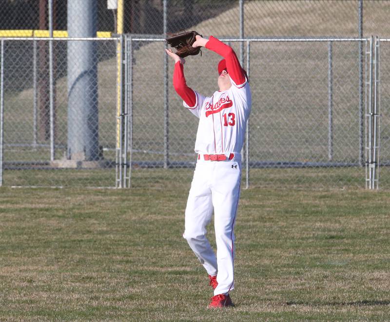 Ottawa's Connor Price makes a catch in center field against Hall on Tuesday, March 28, 2023 at Ottawa High School.