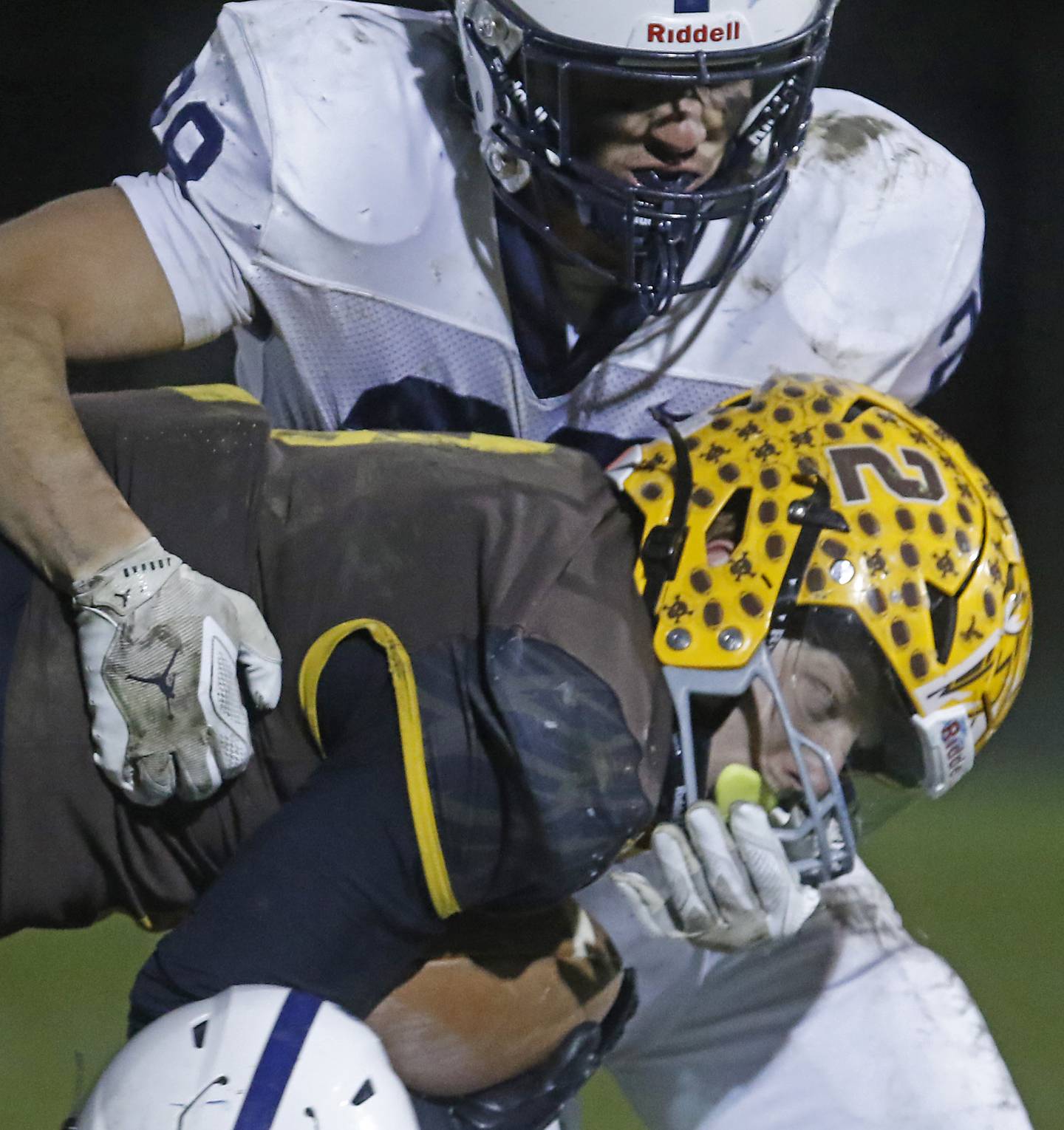 Cary-Grove's Brady Elbert tackles Jacobs' Caden DuMelle during a Fox Valley Conference football game on Friday, Oct. 24, 2025, at Jacobs High School in Algonquin.