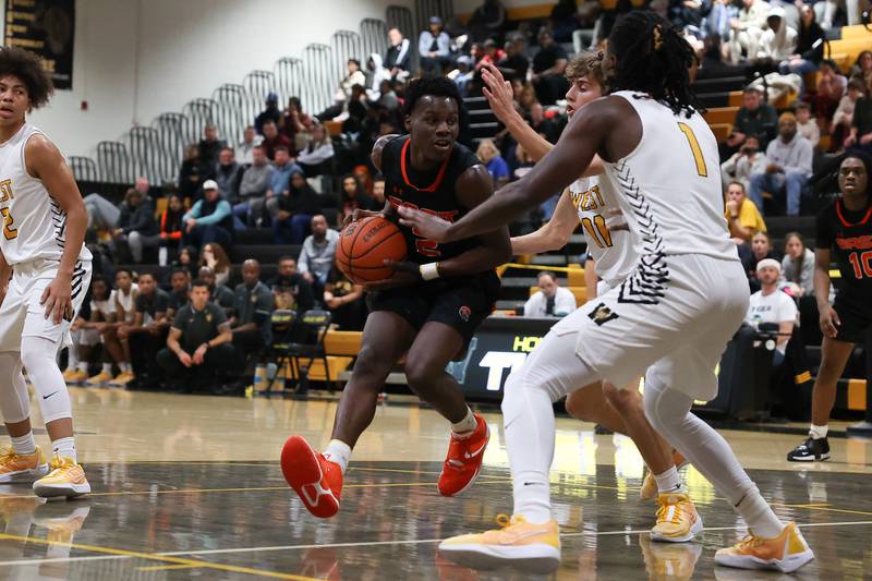 Plainfield East’s Ehi Ognomo makes a move to the paint against Joliet West on Friday, Dec. 8th, 2023 in Joliet.