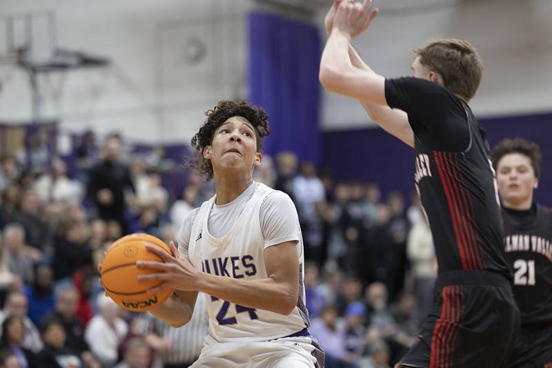 Dixon’s Armahn McGowan looks to put up a shot against Stillman Valley’s Friday, Jan. 9, 2026.