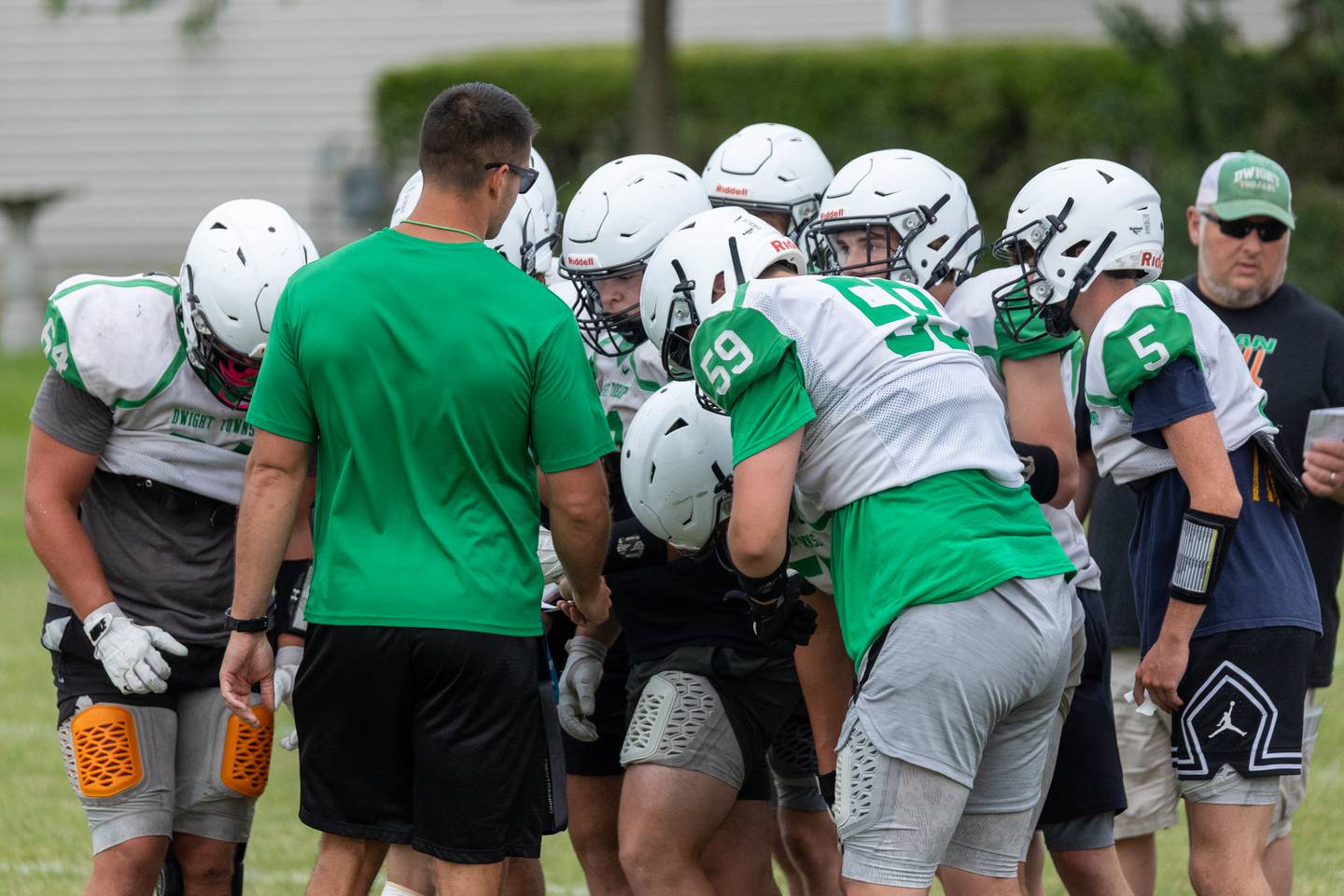Coach Nick Myer of Dwight talks with team on Thursday, July 17, 2025 at Dwight High School in Dwight.