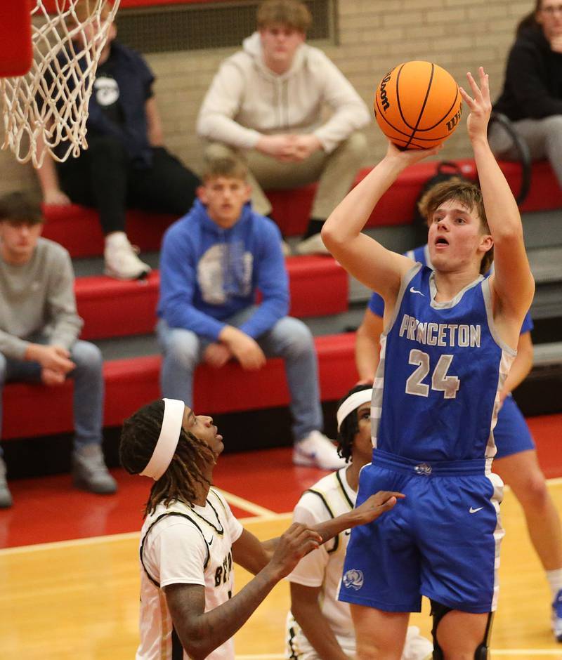 Princeton's Ryan Jagers shoots a jump shot over Oak Forest's Donovan Williams during the Dean Riley Shootin' The Rock Thanksgiving Tournament on Tuesday, Nov. 26, 2024 in Kingman Gym at Ottawa High School.