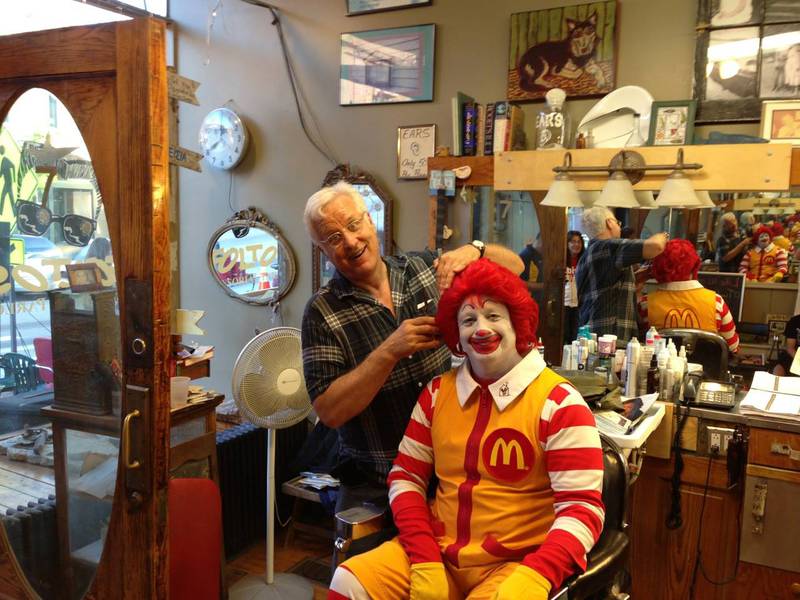 Craig Foltos, owner of downtown Batavia's Foltos' Tonsorial Parlor, cuts Ronald McDonald's hair. "Chop Around the Clock" raises funds for the Ronald McDonald House in Chicago.