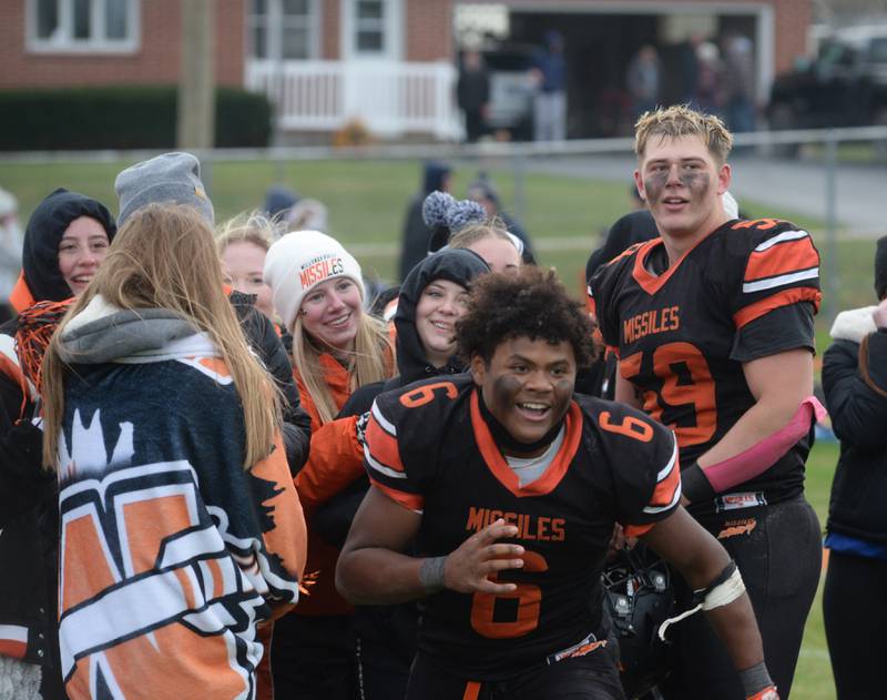 Milledgeville's Micah Toms-Smith (6) celebrates with his team and fans after their 28-14 win over Polo during 8-man semi-final playoff action on Saturday, Nov. 16, 2024 at Milledgeville.