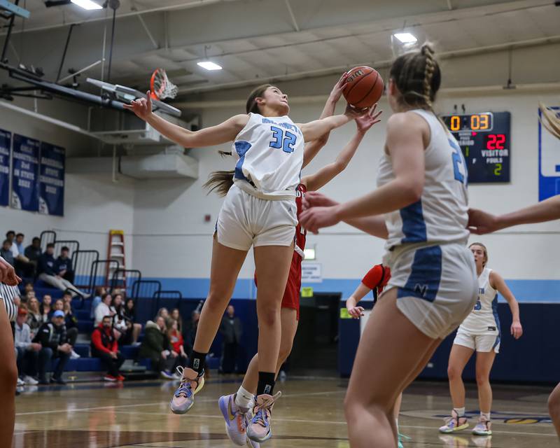 Nazareth's Stella Sakalas (32) leaps for rebound during varsity basketball game between Deerfield at Nazareth.  Jan 23, 2023.