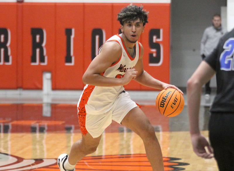 McHenry’s Adam Anwar moves the ball against Burlington Central’s in varsity boys basketball on Friday, Dec. 5, 2025, at McHenry Community High School in McHenry.