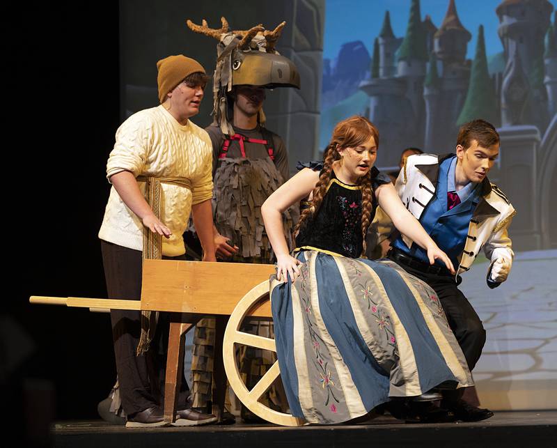 Jess Ardis (Ana) and Logan Cook (Prince Hans) are ousted from Olaf’s ice cart Wednesday, April 15, 2026, during rehearsal for Newman High School’s rendition of “Frozen.” Shows will begin at 7 p.m. April 17, at 7 p.m. April 18 and at 2 p.m. April 19 at Centennial Auditorium on the campus of Sterling High School.