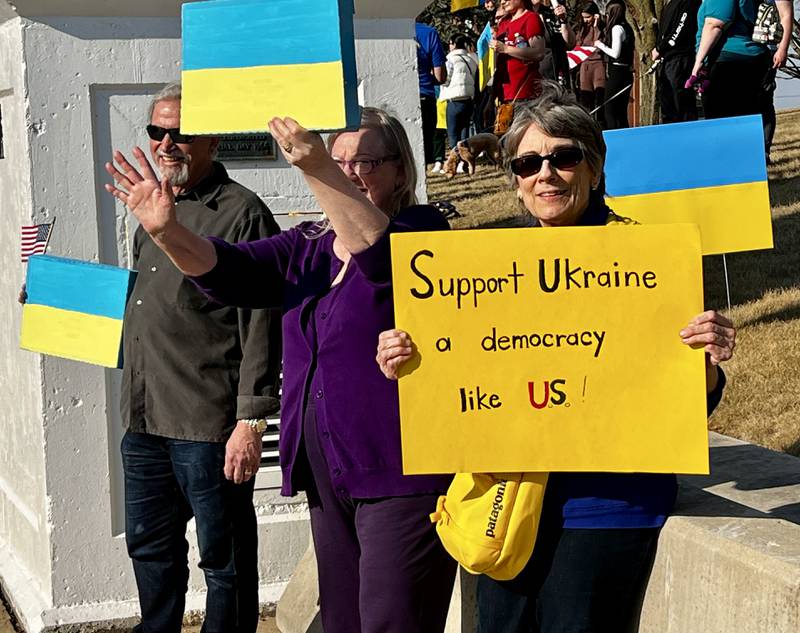 Marc Adami, Jane Ardapple and Cheryl Geiger show their support for Ukraine during a vigil in Dixon on March 13, 2025.