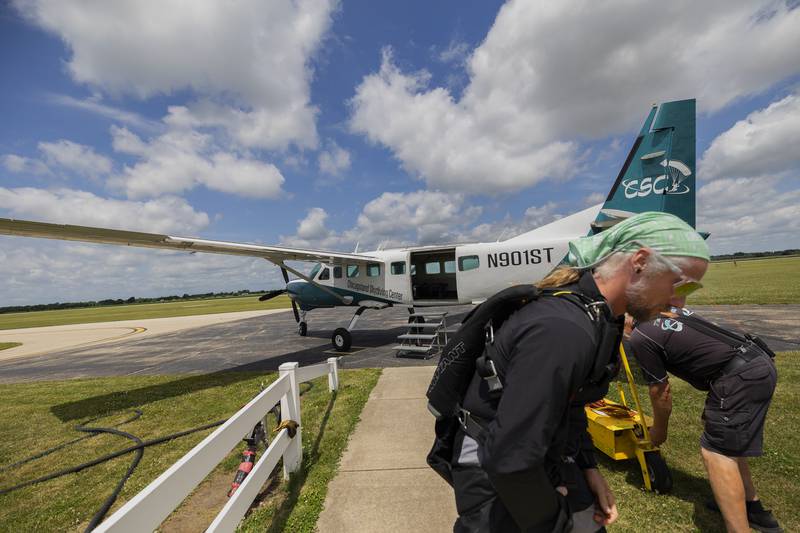After a short weather delay, the first group of the day prepares to board the plane Friday, June 27, 2025, for the jump.