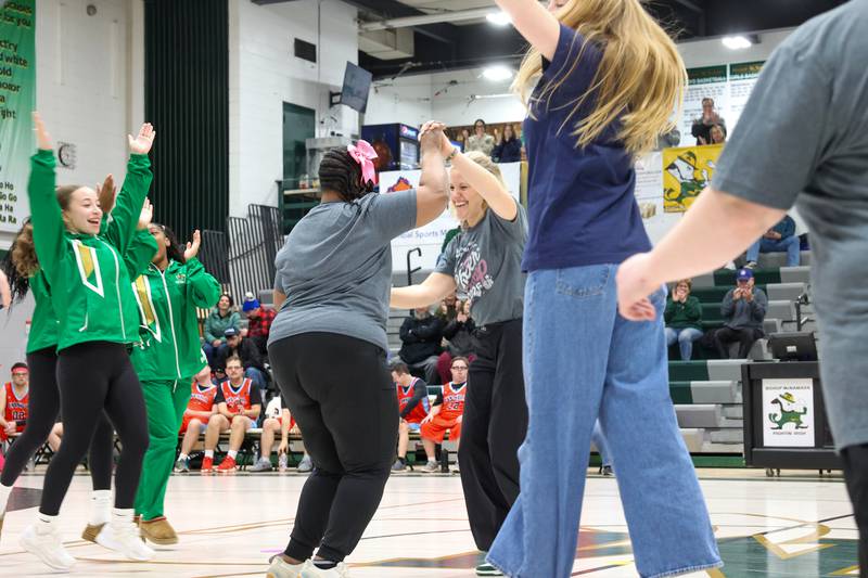 Bishop McNamara principal Kaelyn Bess dances with River Valley Special Rec cheerleaders during their halftime performance at the RVSRA game against Lincolnway Special Recreation Association at Bishop McNamara on Friday, Jan. 30, 2026.