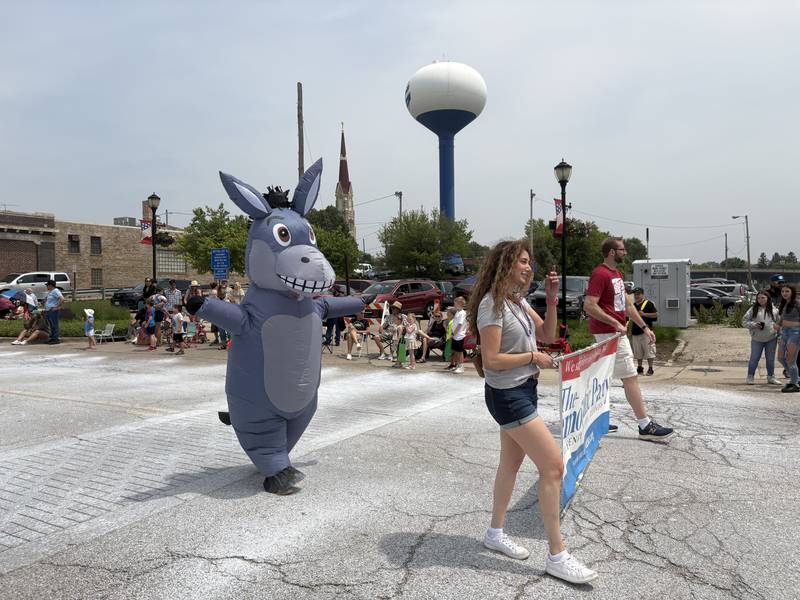 Democratic Party of McHenry County  members participate in the Harvard Milk Days parade June 7, 2025.