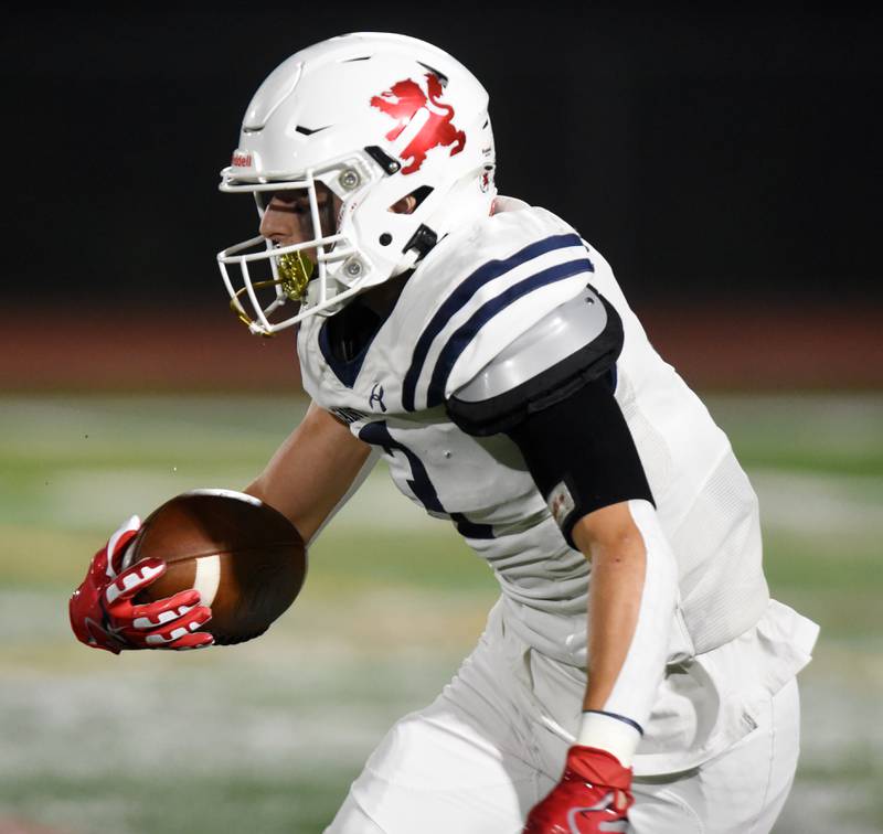 Joe Lewnard/jlewnard@dailyherald.com
St. Viator’s Driese Raap returns a Carmel punt during Friday’s game in Mundelein.