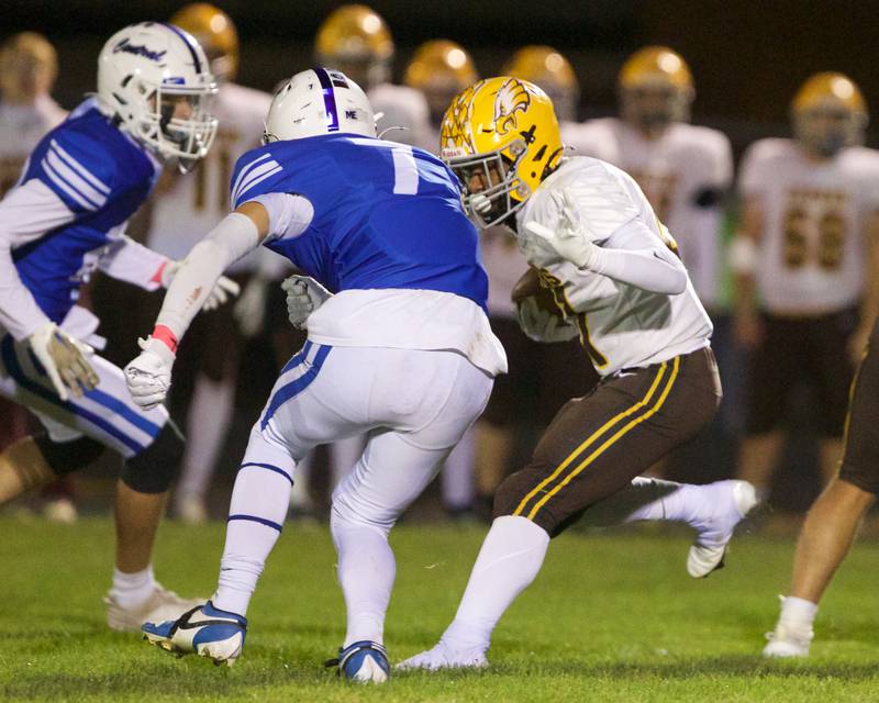 Jacobs Cameron Arthur looks to avoid the sack by Burlington Central's Liam Ballantyne on Friday, October 4,2024 in Burlington.