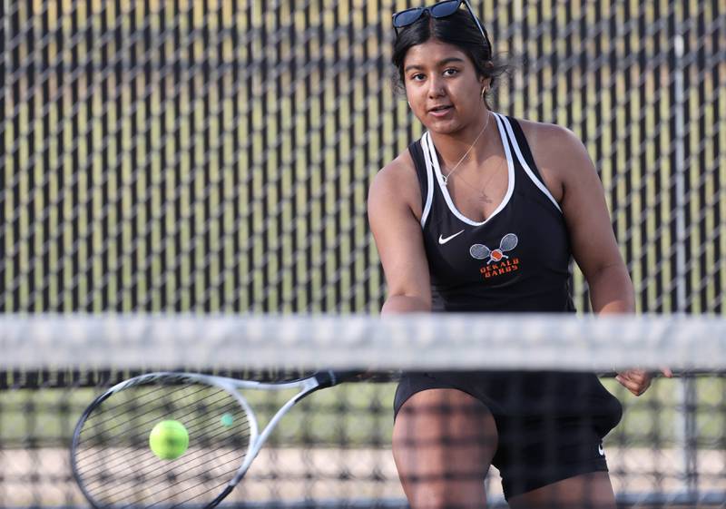 DeKalb number one doubles player Preeti Islam returns a serve during her match against Sycamore Wednesday, Sept. 13, 2023, at DeKalb High School.