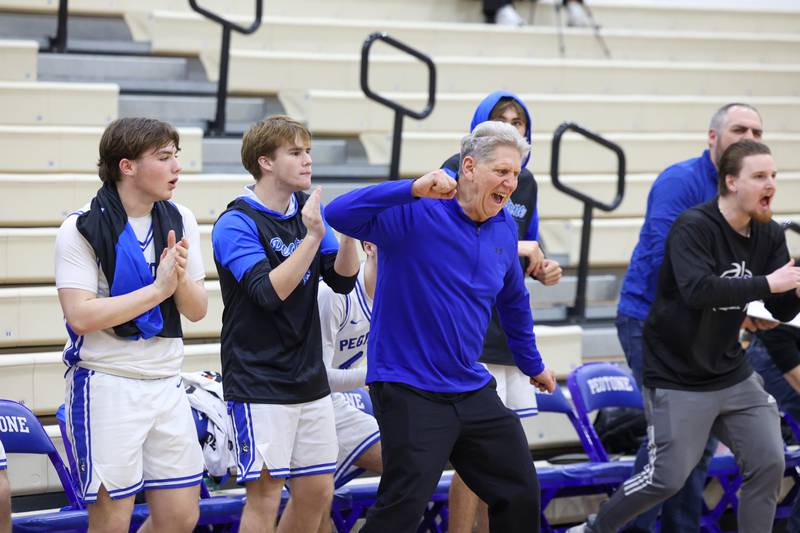 Peotone head coach Ron Oloffson celebrates a scoring play to bring the Blue Devils back to within one point en route to a 64-52 victory over Beecher on Wednesday, Jan. 28, 2026.