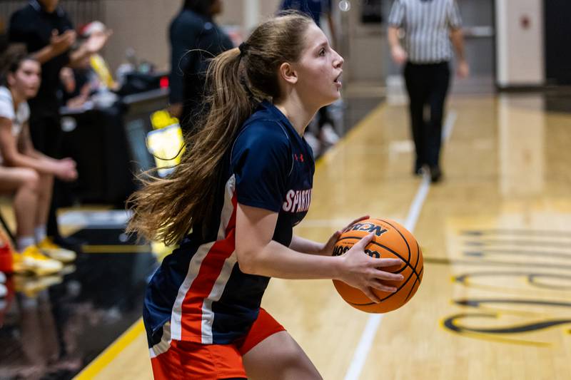 Romeoville's Kacey Foust squares-up to shoot during a varsity girls basketball game against Joliet West at Joliet West on Dec. 11, 2025.