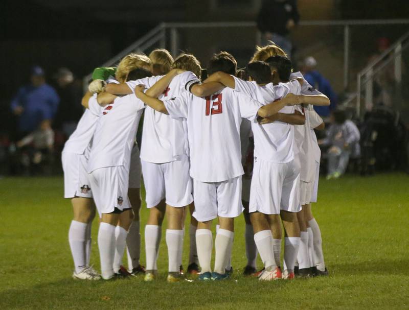 Members of the Earlville soccer team huddle before playing Somonauk in the Little Ten Conference championship game on Thursday, Oct. 5,  2023 at Hinckley High School.
