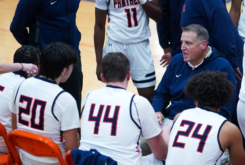 Oswego’s head coach Chad Pohlmann talks to his team during a basketball game against West Aurora at Oswego High School on Friday, Dec 1, 2023.