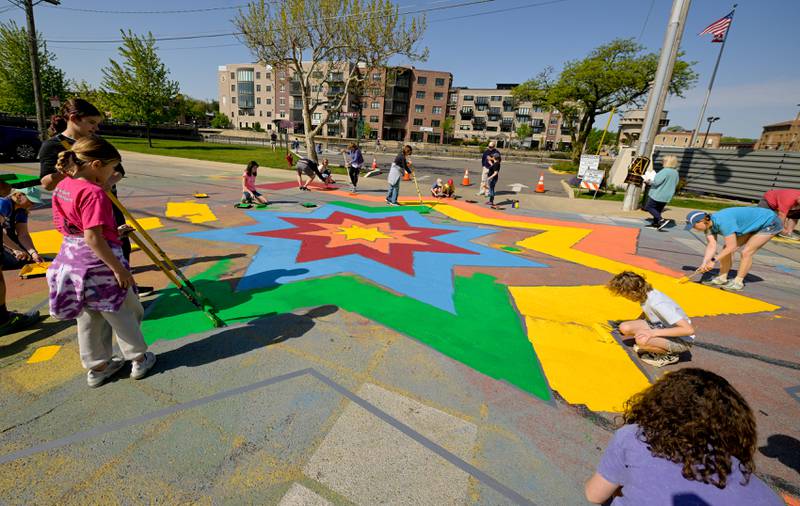 People of all ages turned out to participate in the St. Charles Art CouncilÕs ÒPaint the RiversideÓ in the intersection of Walnut and Riverside Avenues on Saturday, May 10, 2025 in St. Charles.