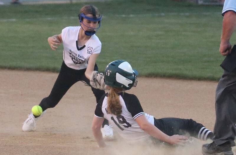 Evergreen Park's Maura Maloney slides into second base as Spring Valley's Callie Fusinetti misses the throw in the Minor League Softball State title game on Thursday, July 27, 2023 at St. Mary's Park in La Salle.