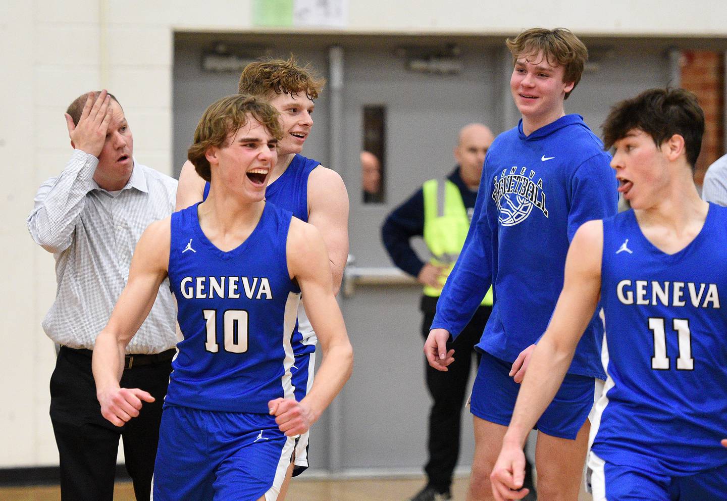 Geneva players, including Jack Hatton (10) and Kalen McNeive (11) celebrate following their win over Wheaton Warrenville South during the Class 4A Bartlett Sectional semifinals Wednesday.