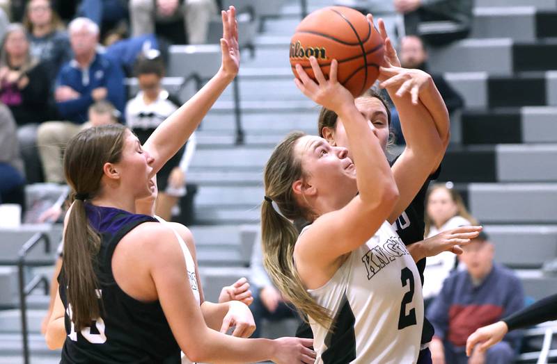 Kaneland’s Kailey Plank is fouled by Plano’s Josie Larson during their game Tuesday, Dec. 13, 2022, at Kaneland High School in Maple Park.