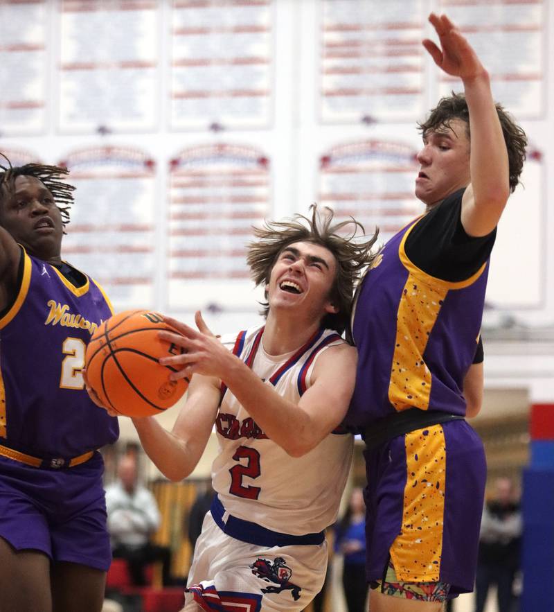 Dundee-Crown’s Jared Russell battles under the hoop against Wauconda in varsity basketball Friday, Dec. 20, 2024 at Dundee-Crown High School in Carpentersville.