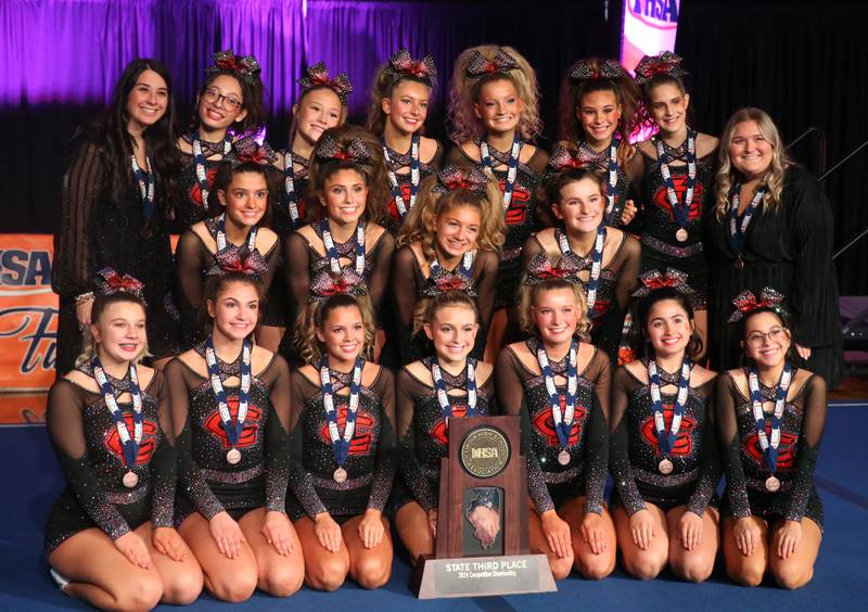 Members of the Crystal Lake Central cheerleading team pose with the third-place trophy for the Competitive Cheerleading State Final Competition on Saturday, Feb. 3, 2024 at Grossinger Motors Arena in Bloomington.