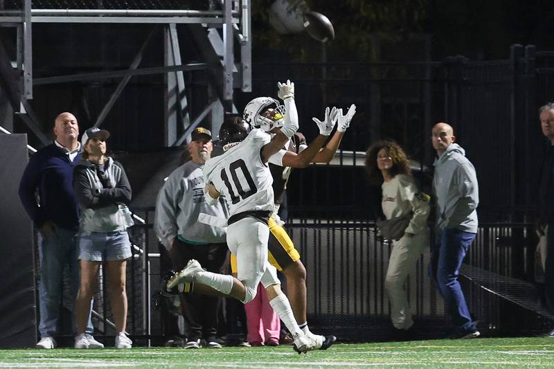 Mount Carmel’s Quentin Burell pulls in the deep pass to set up a first and goal against Joliet Catholic on Friday, Oct. 11, 2024 in Chicago.