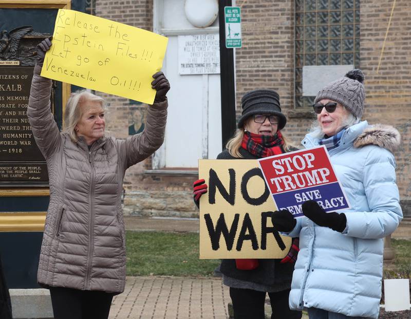 Protesters held signs and waved flags Tuesday, Jan. 6, 2026, during a Venezuela Rapid Response Rally at Memorial Park on the corner of First Street and Lincoln Highway in DeKalb. The group gathered to voice their opposition to President Donald Trump and the administrations recent actions in Venezuela.