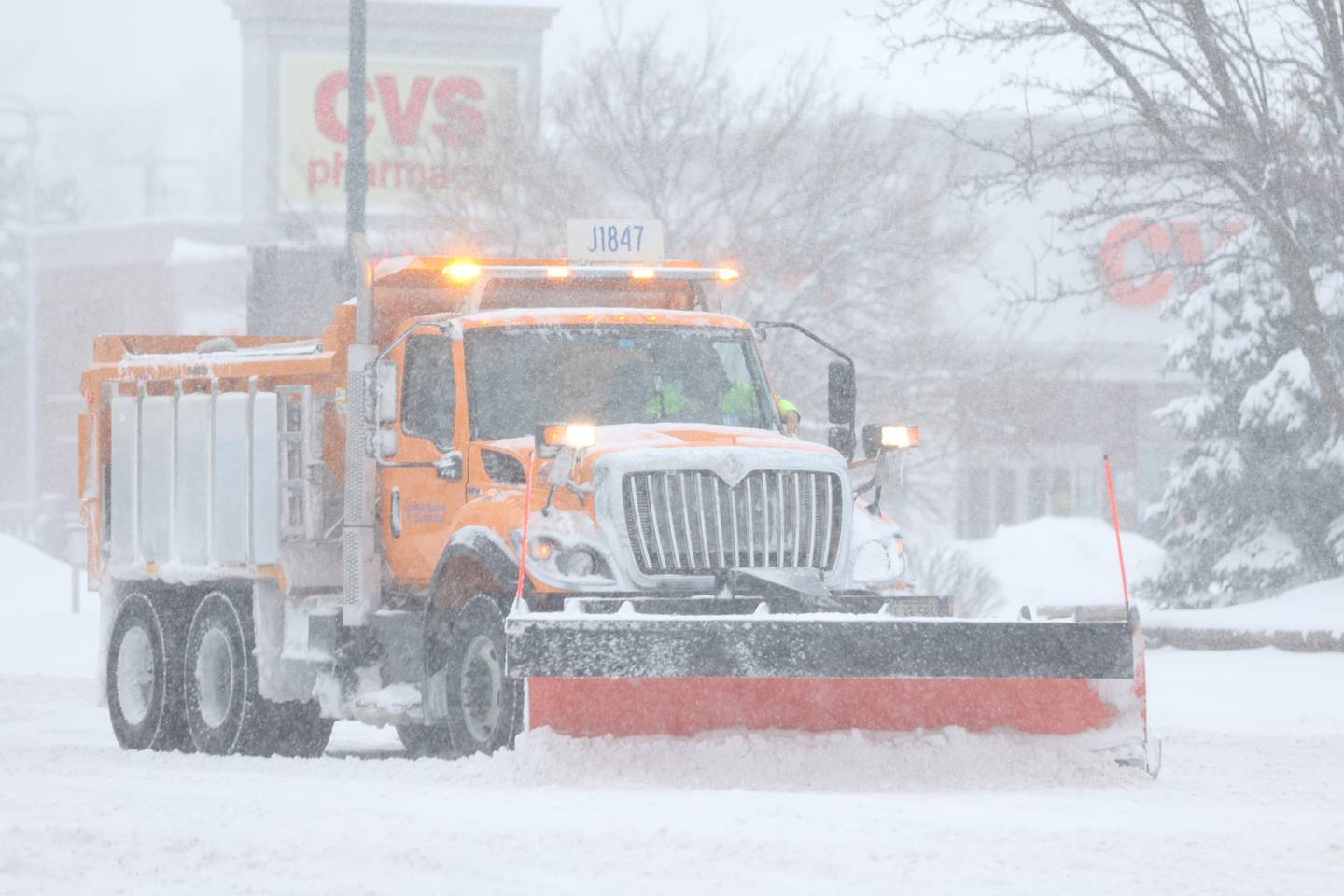 A slow plow works along US Route 30. Wednesday, Feb. 2, 2022, in Joliet.