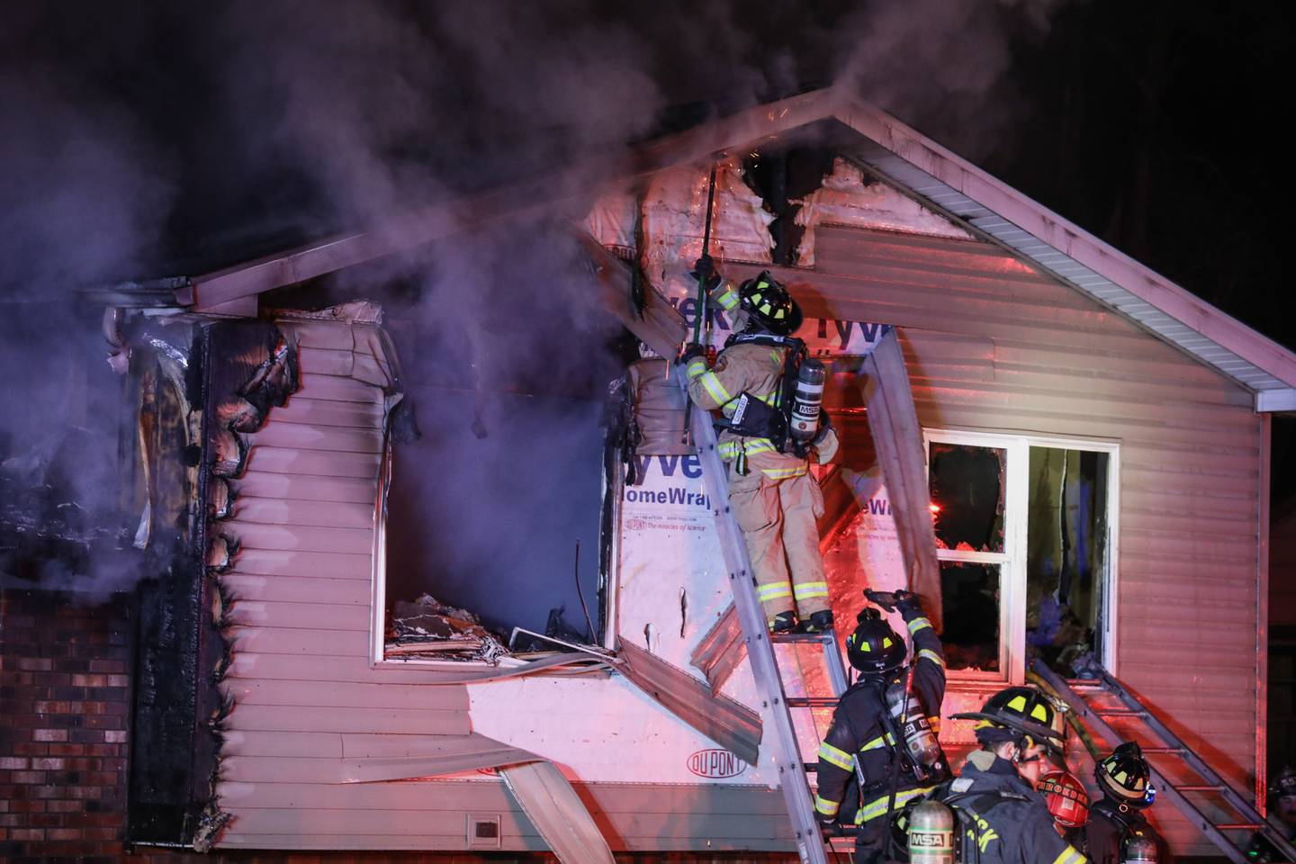 Firefighters from the McHenry Township Fire Protection District respond to a house fire Saturday, Dec. 11, 2021, in the 500 block of Sunrise Drive in unincorporated McHenry County near Johnsburg.