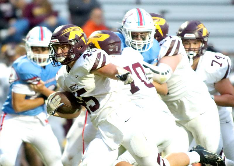 Richmond-Burton’s Riley Shea sprints with the ball in varsity football at George Harding Field on the campus of Marian Central High School in Woodstock on Friday, August 29, 2025.