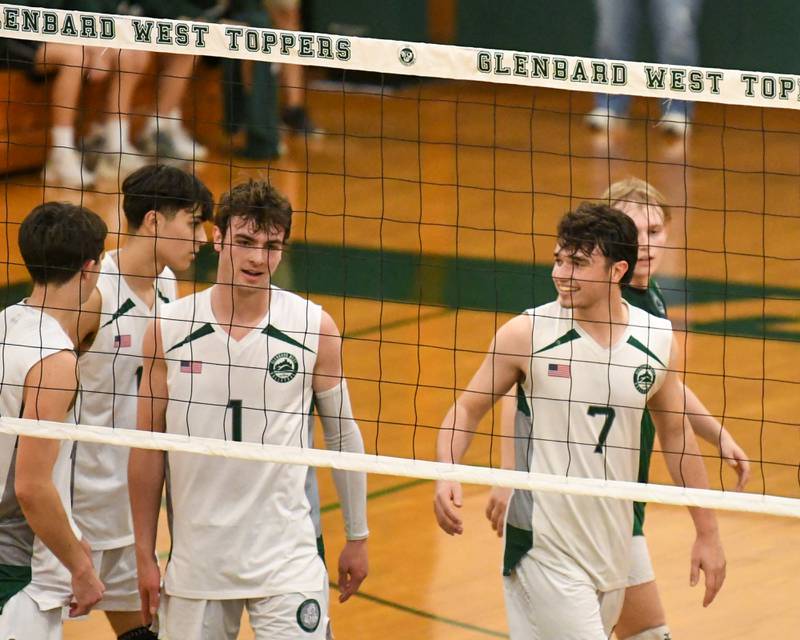 Glenbard West's Adam Graham (7) is all smiles after getting a point while taking on Oak Park-River Forest on Tuesday April 16, 2024, held at Glenbard West High School.