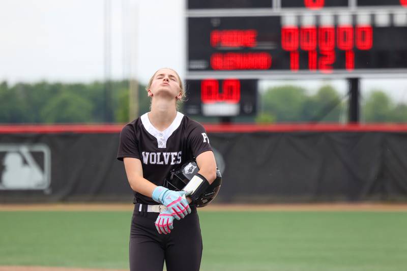 Prairie Ridge's Kylie Caroll leaves the field after a scoreless inning during the Wolves' 5-0 loss to Glenwood in the IHSA Class 3A state semifinal on June 13, 2025.