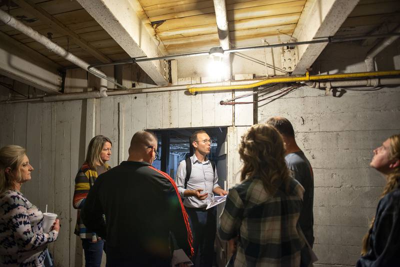 Michael Smith, representative for architectural firm Studio GWA of Rockford, leads a tour through the National building on Oct. 5, 2022.